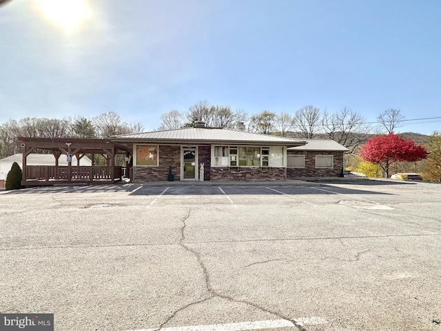 view of property with uncovered parking