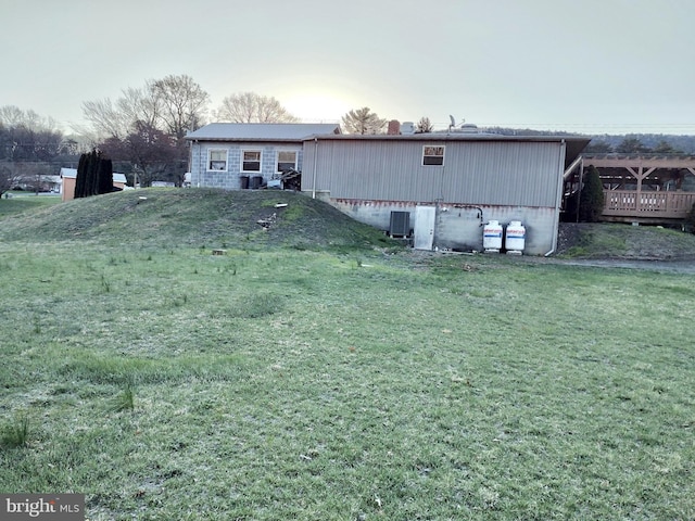 back of property with a lawn