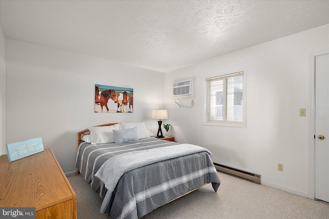 carpeted bedroom with baseboards, baseboard heating, a textured ceiling, and a wall mounted air conditioner