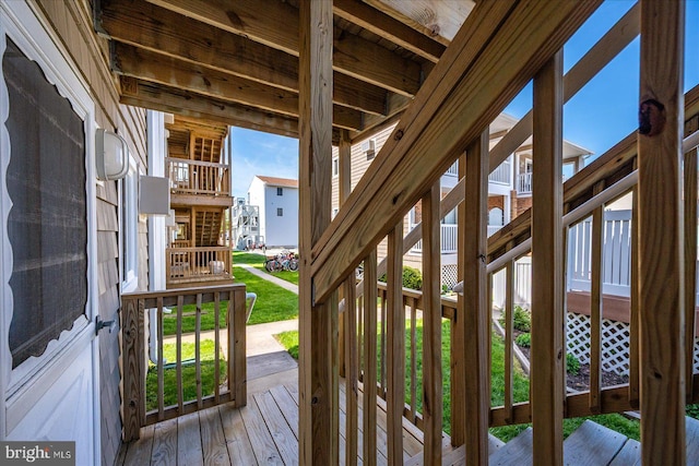 deck with stairway and covered porch