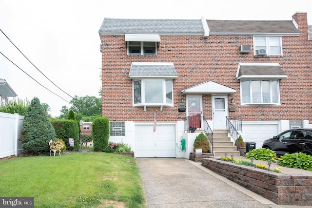 view of property featuring driveway, roof with shingles, a front yard, an attached garage, and fence