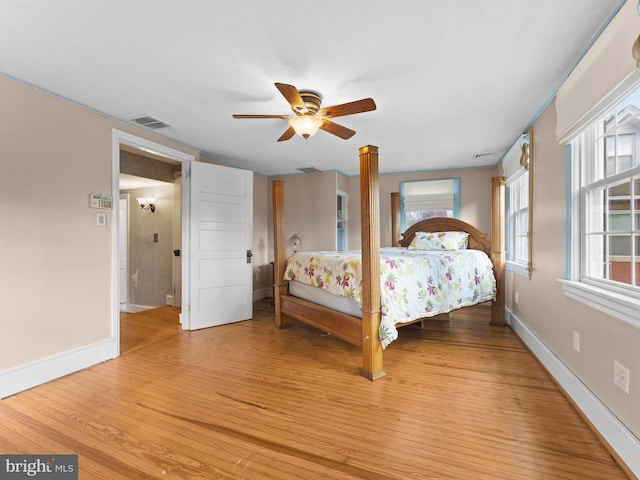 108 Delaware St, Woodbury, NJ 08096 - bedroom with light wood finished floors, baseboards, and multiple windows