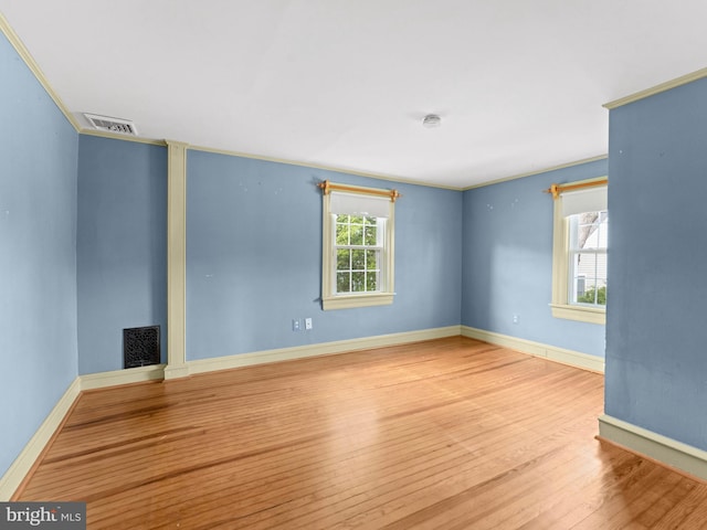108 Delaware St, Woodbury, NJ 08096 - empty room with wood finished floors, baseboards, and crown molding