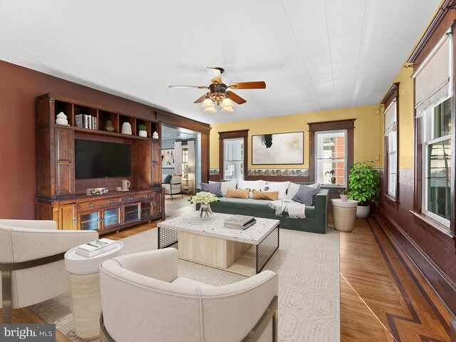 108 Delaware St, Woodbury, NJ 08096 - living room with ceiling fan, wood finished floors, and baseboards