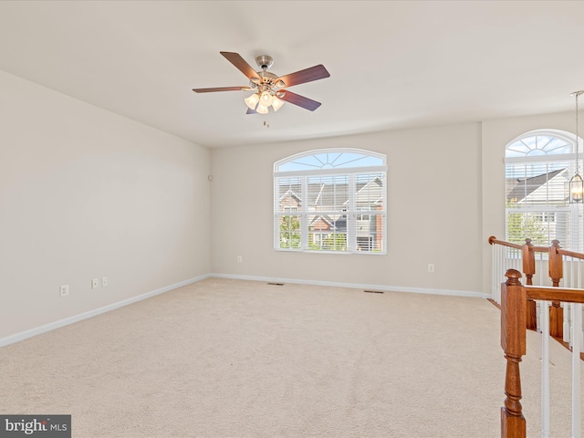 20822 Brunswick Ln, Millsboro, DE 19966 - empty room featuring healthy amount of natural light, baseboards, and light carpet