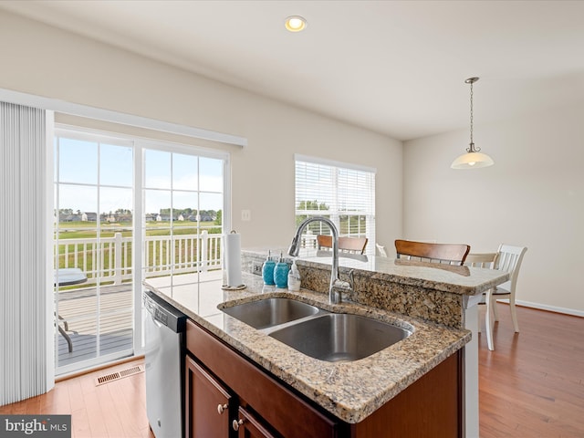 20822 Brunswick Ln, Millsboro, DE 19966 - kitchen with a sink, stainless steel dishwasher, a center island with sink, light wood-type flooring, and recessed lighting