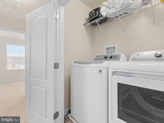 20822 Brunswick Ln, Millsboro, DE 19966 - laundry room with independent washer and dryer, baseboards, and carpet flooring