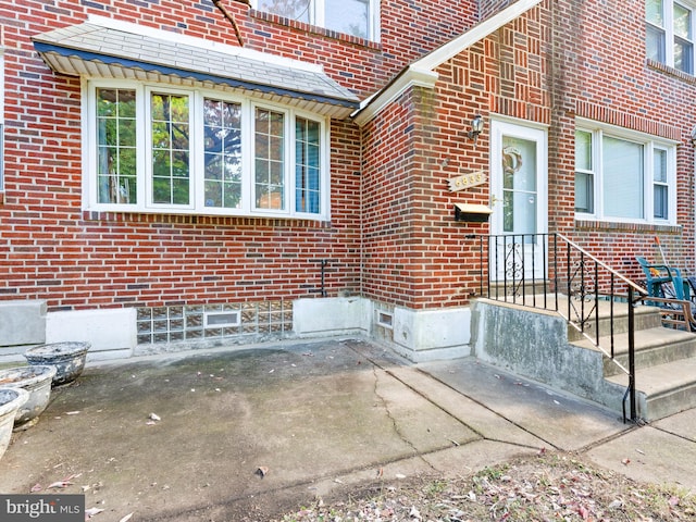 6833 E Roosevelt Blvd, Philadelphia, PA 19149 - view of exterior entry featuring a patio area and brick siding