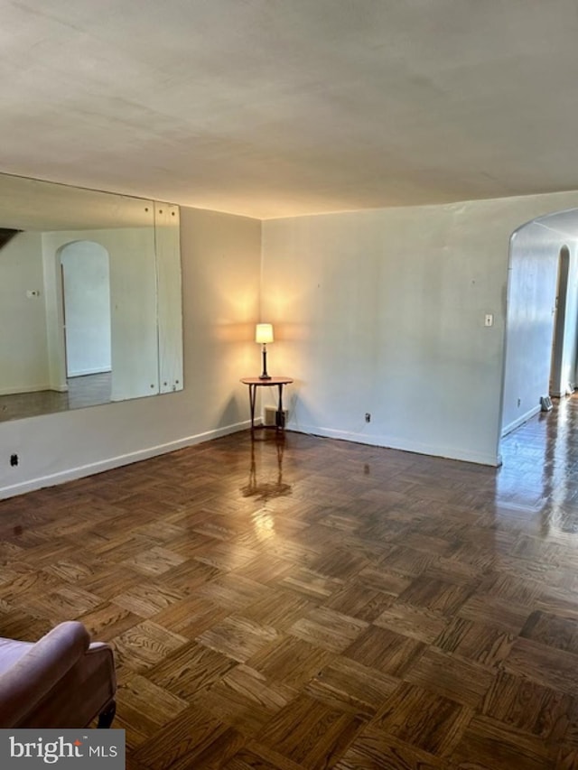 6833 E Roosevelt Blvd, Philadelphia, PA 19149 - empty room with baseboards and arched walkways