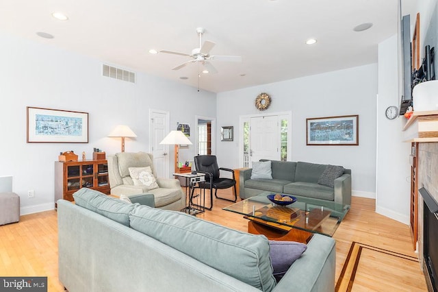 536 Yacht Club Dr, Ocean Pines, MD 21811 - living room with a ceiling fan, a fireplace, light wood finished floors, baseboards, and recessed lighting