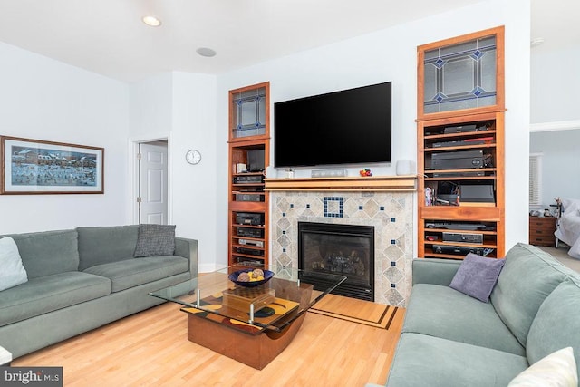 536 Yacht Club Dr, Ocean Pines, MD 21811 - living area with wood finished floors, a tile fireplace, and recessed lighting