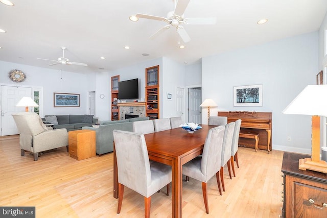 536 Yacht Club Dr, Ocean Pines, MD 21811 - dining space featuring ceiling fan, light wood-style floors, a fireplace, recessed lighting, and baseboards