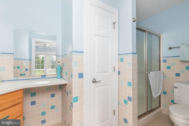 536 Yacht Club Dr, Ocean Pines, MD 21811 - full bathroom with tile walls, wainscoting, toilet, a stall shower, and ceiling fan