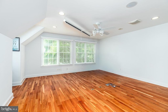 536 Yacht Club Dr, Ocean Pines, MD 21811 - spare room featuring wood finished floors, a ceiling fan, baseboards, recessed lighting, and vaulted ceiling