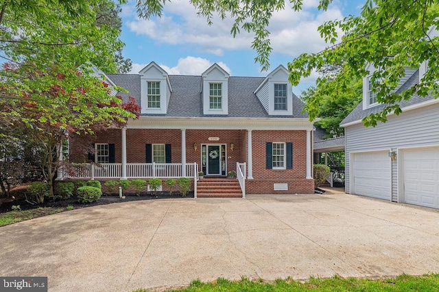 536 Yacht Club Dr, Ocean Pines, MD 21811 - new england style home featuring brick siding, covered porch, concrete driveway, crawl space, and a garage