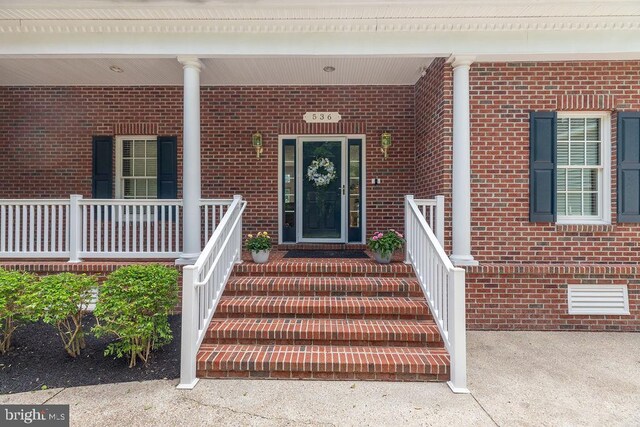 536 Yacht Club Dr, Ocean Pines, MD 21811 - view of exterior entry with brick siding and covered porch