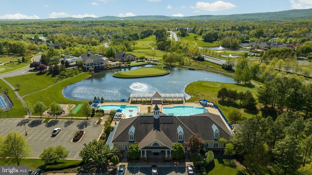 bird's eye view featuring a water view and a wooded view