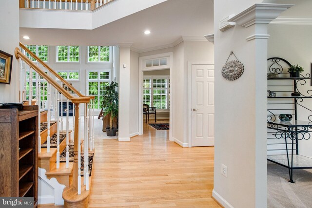 18565 Kerill Rd, Triangle, VA 22172 - corridor featuring ornamental molding, stairs, light wood-style flooring, baseboards, and recessed lighting