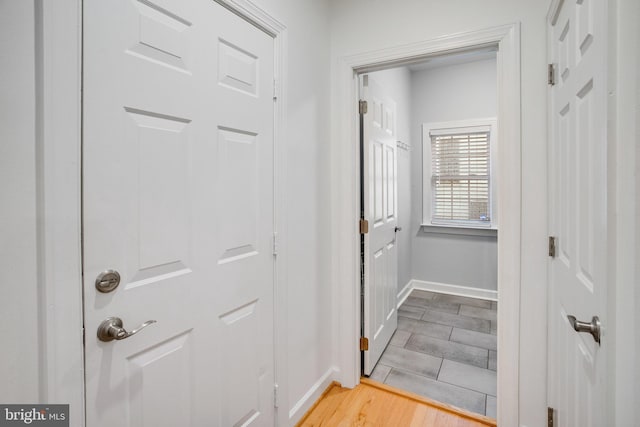 18565 Kerill Rd, Triangle, VA 22172 - doorway to outside featuring baseboards and wood finished floors