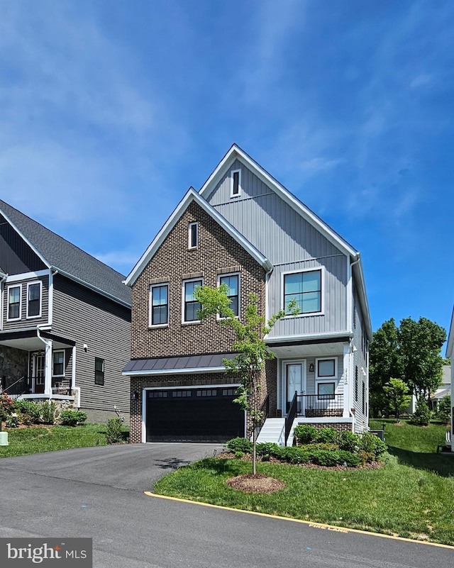 21340 Rainier Ln, Broadlands, VA 20148 - view of front facade featuring an attached garage, brick siding, asphalt driveway, and a front lawn