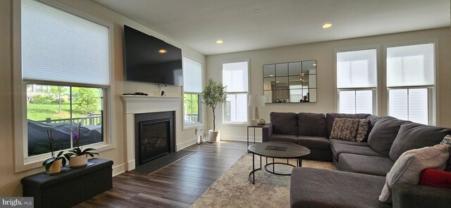 21340 Rainier Ln, Broadlands, VA 20148 - living area with healthy amount of natural light, dark wood-style floors, baseboards, and recessed lighting