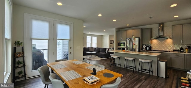 21340 Rainier Ln, Broadlands, VA 20148 - dining area featuring wet bar, dark wood-style flooring, and recessed lighting