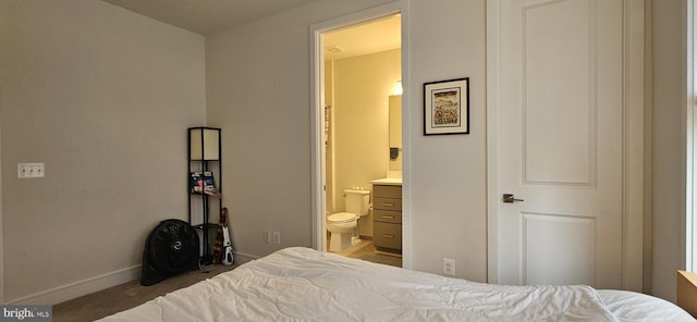 21340 Rainier Ln, Broadlands, VA 20148 - carpeted bedroom with baseboards and ensuite bath