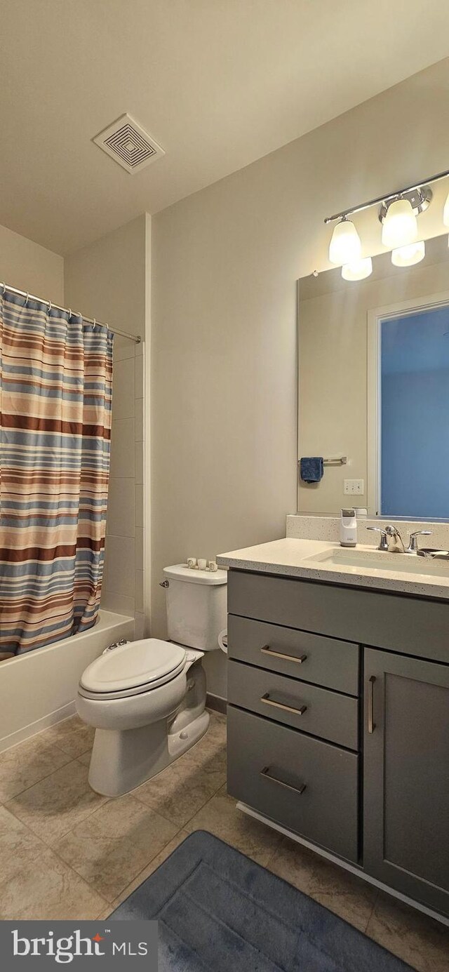 21340 Rainier Ln, Broadlands, VA 20148 - bathroom featuring toilet, vanity, shower / tub combo, and tile patterned floors