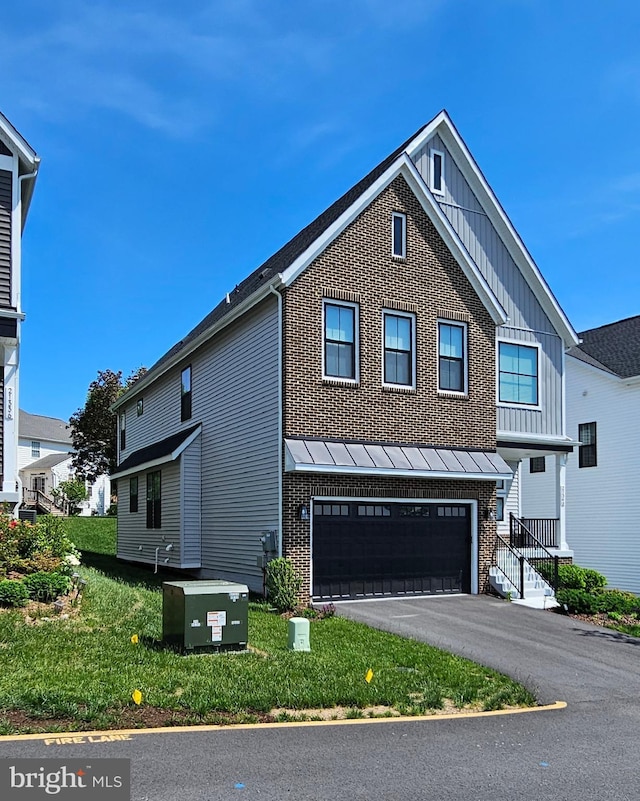 21340 Rainier Ln, Broadlands, VA 20148 - view of front facade featuring brick siding, a garage, board and batten siding, and asphalt driveway