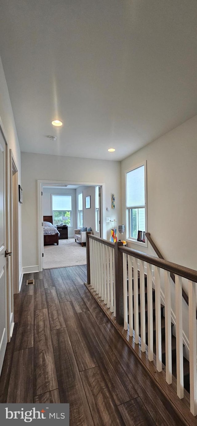 21340 Rainier Ln, Broadlands, VA 20148 - hall featuring dark wood-style floors, healthy amount of natural light, baseboards, and recessed lighting