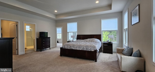 21340 Rainier Ln, Broadlands, VA 20148 - bedroom featuring light carpet, a raised ceiling, recessed lighting, connected bathroom, and baseboards