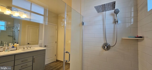 21340 Rainier Ln, Broadlands, VA 20148 - full bathroom featuring a shower stall, wood finished floors, and vanity