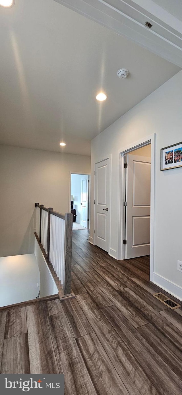 21340 Rainier Ln, Broadlands, VA 20148 - hallway featuring an upstairs landing, dark wood-style flooring, baseboards, and recessed lighting