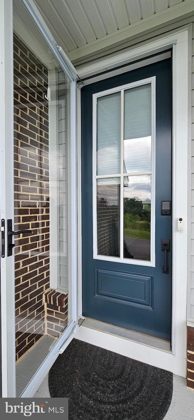 21340 Rainier Ln, Broadlands, VA 20148 - doorway to property with brick siding