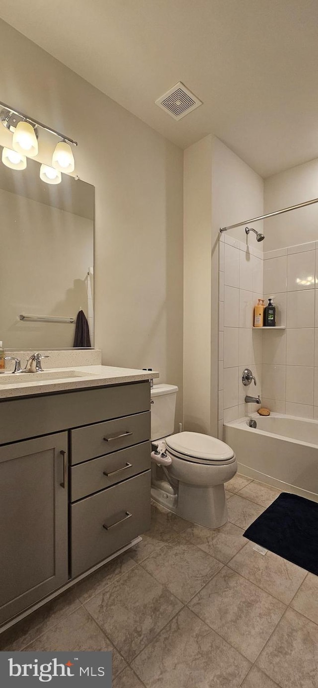21340 Rainier Ln, Broadlands, VA 20148 - bathroom with toilet, vanity, shower / washtub combination, and tile patterned floors