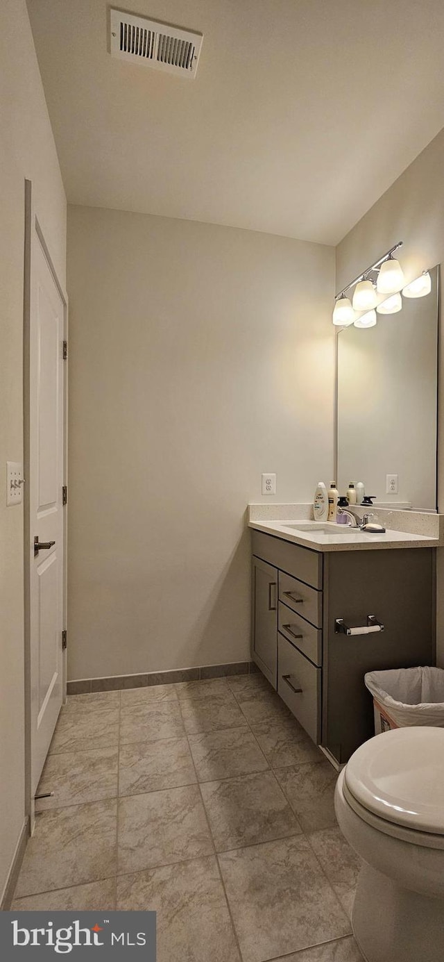 21340 Rainier Ln, Broadlands, VA 20148 - bathroom featuring vanity, baseboards, and toilet