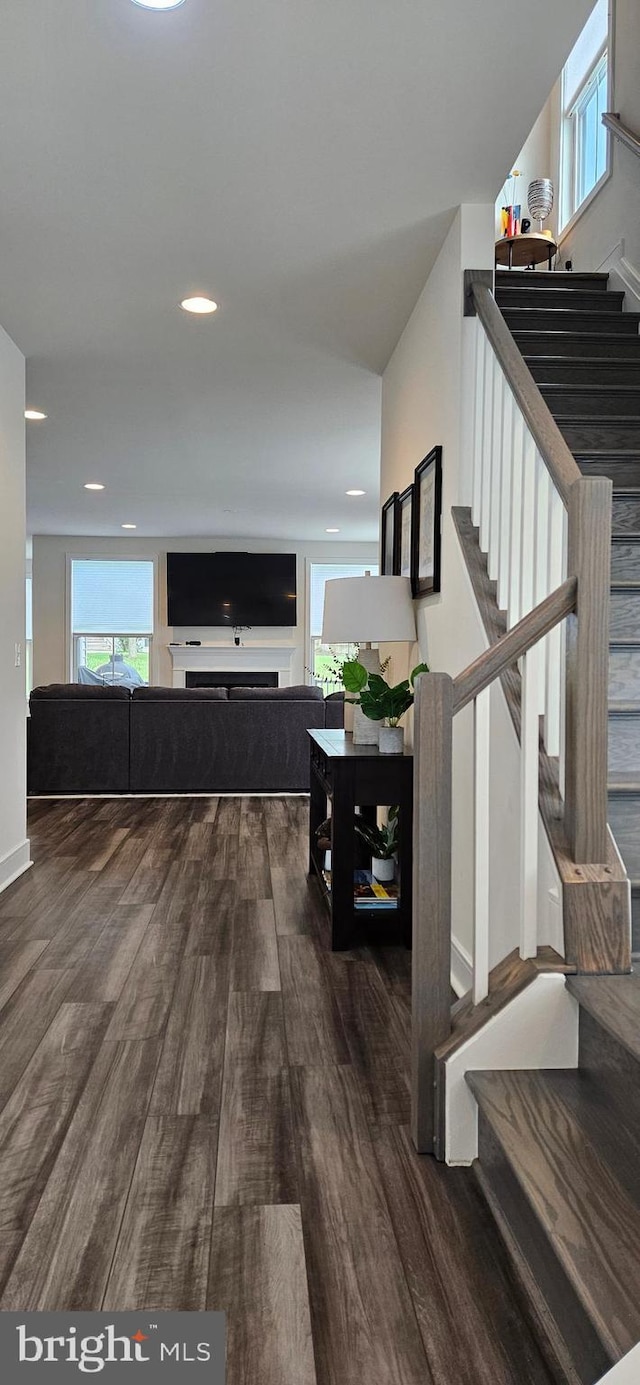 21340 Rainier Ln, Broadlands, VA 20148 - corridor with wood finished floors, stairway, and recessed lighting