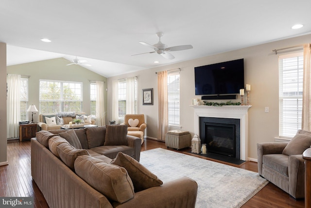 living area featuring a fireplace with flush hearth, ceiling fan, dark wood-style floors, recessed lighting, and vaulted ceiling