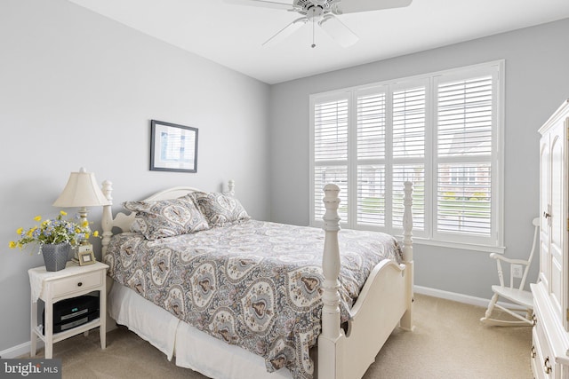 bedroom featuring baseboards, ceiling fan, and carpet floors
