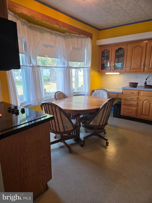 dining room featuring crown molding