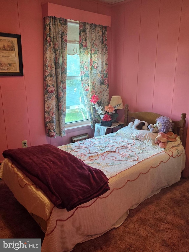 bedroom featuring a decorative wall
