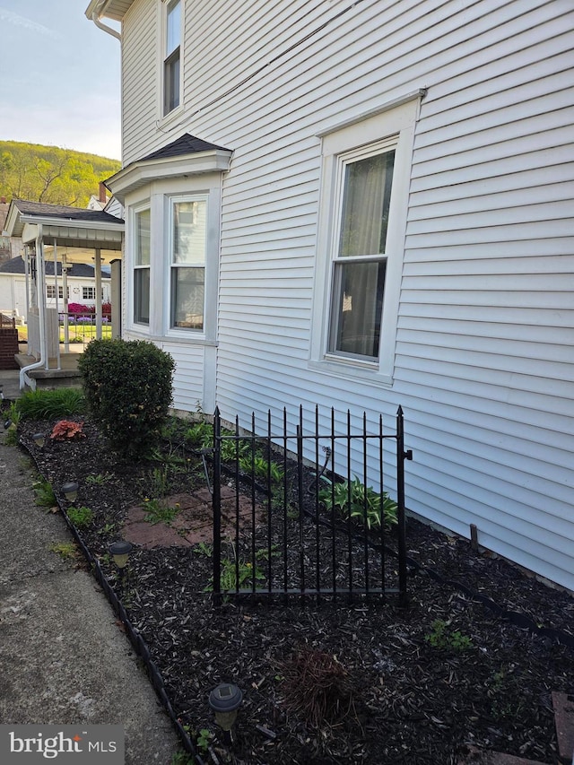 view of side of home with fence