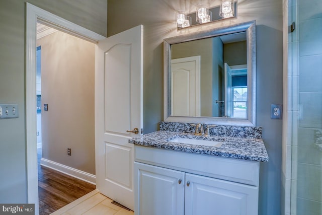 30780 Lindell Ln, Frankford, DE 19945 - bathroom with vanity, baseboards, and wood finished floors