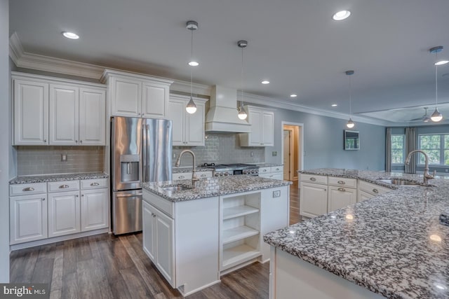 30780 Lindell Ln, Frankford, DE 19945 - kitchen with a sink, stainless steel fridge, custom exhaust hood, and an island with sink