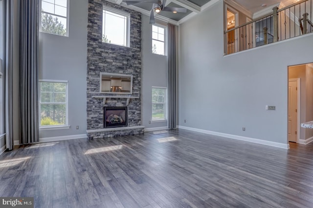 30780 Lindell Ln, Frankford, DE 19945 - unfurnished living room featuring a fireplace, a ceiling fan, baseboards, and a towering ceiling