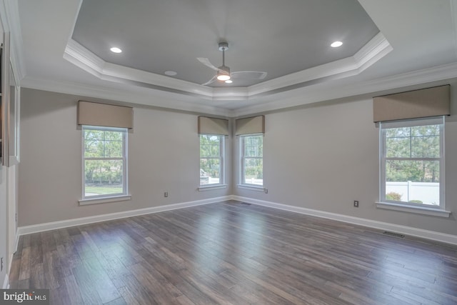 30780 Lindell Ln, Frankford, DE 19945 - empty room featuring crown molding, dark wood-type flooring, a raised ceiling, and ceiling fan