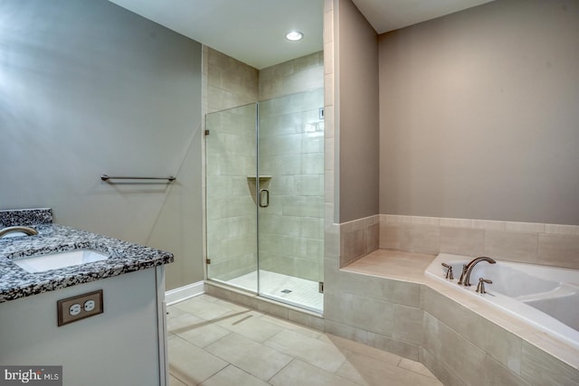 30780 Lindell Ln, Frankford, DE 19945 - bathroom featuring tile patterned flooring, vanity, recessed lighting, a bath, and a stall shower