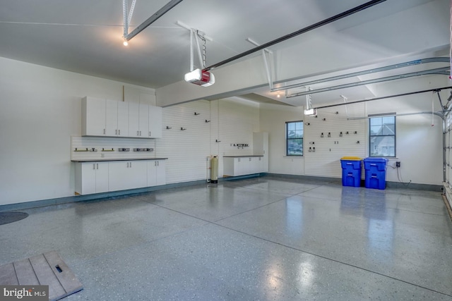 30780 Lindell Ln, Frankford, DE 19945 - garage with baseboards and a garage door opener