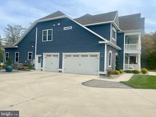 30780 Lindell Ln, Frankford, DE 19945 - view of front of home featuring an attached garage, driveway, and a balcony