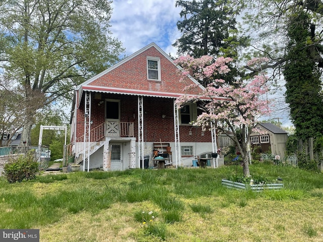 rear view of house with brick siding